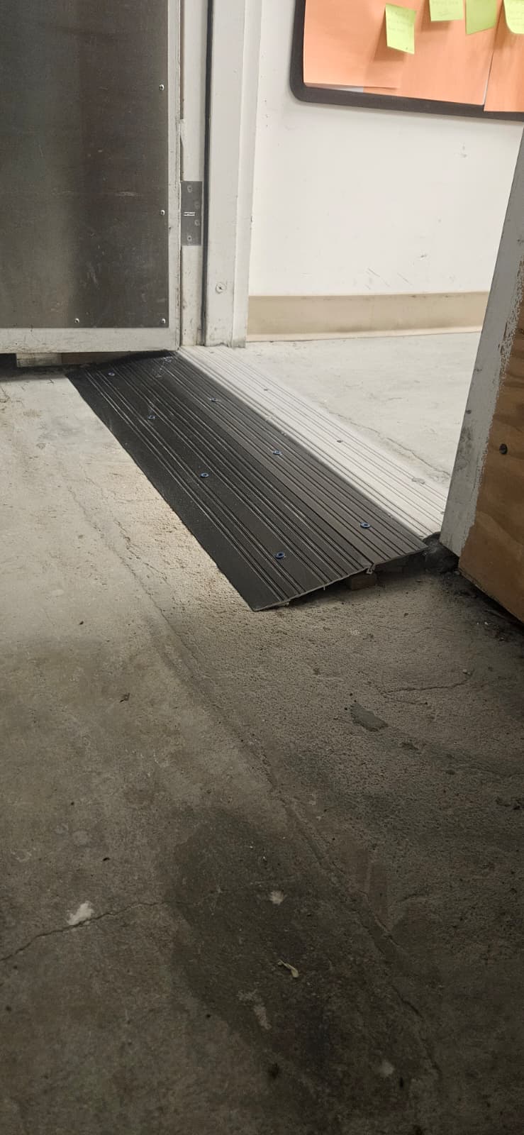 A Step at a Sunrise Stockroom Door Was Blocking Dollies and Carts after